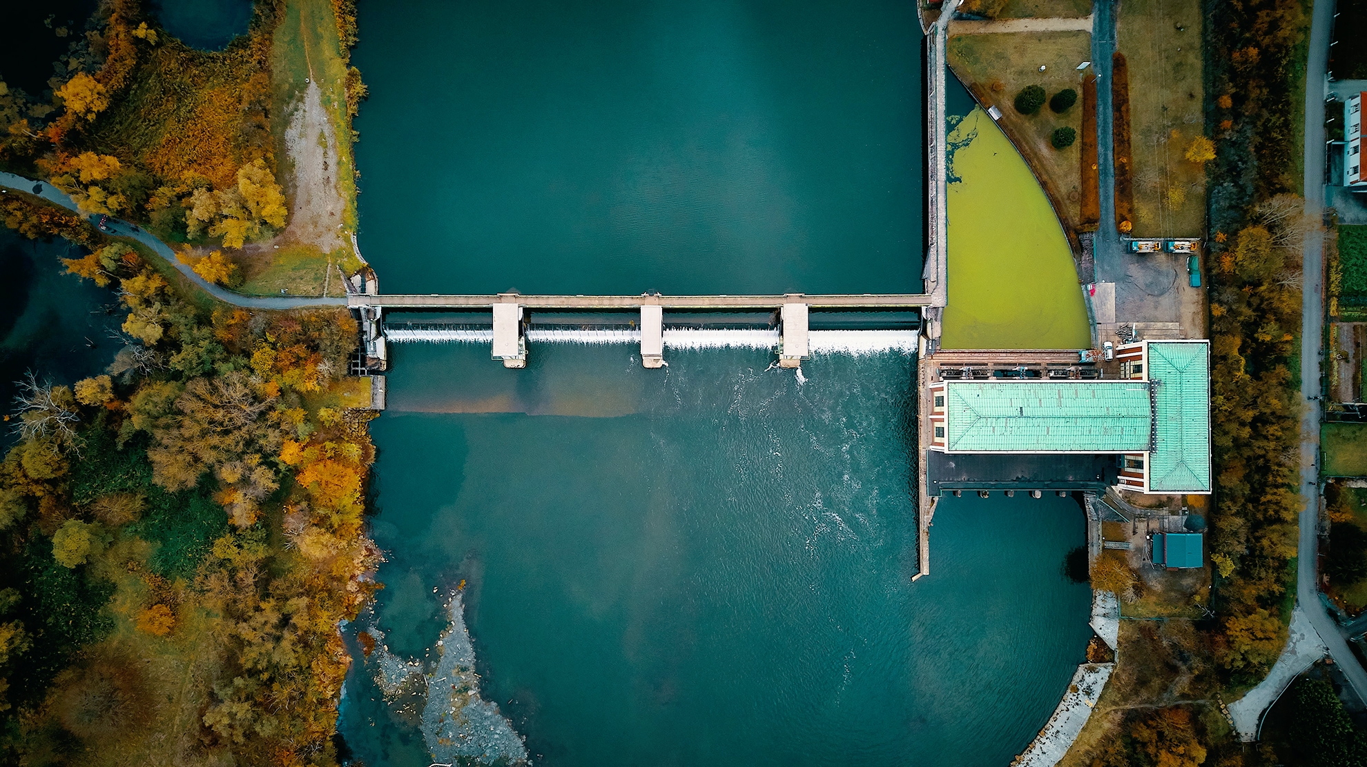 Image of a Dam in the autumn to represent Volue corporate governance